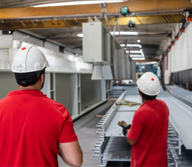 Two co-workers supervising production at the factory.